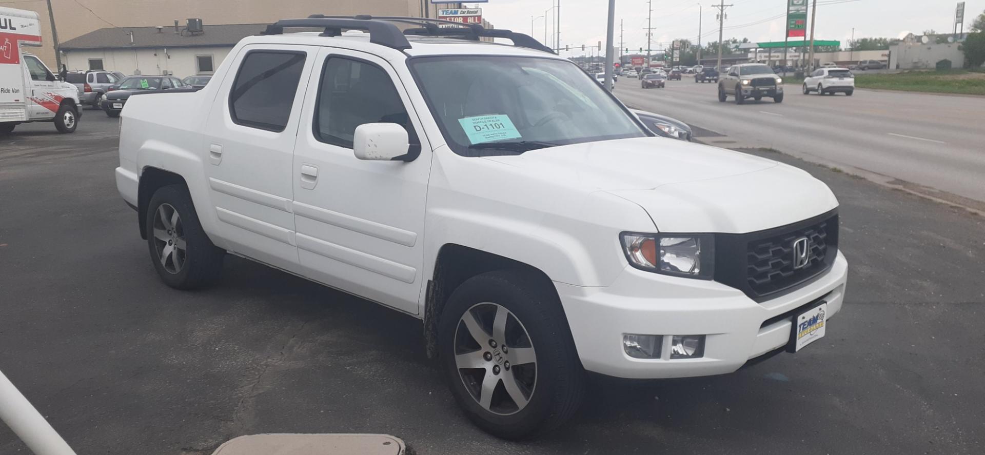 2014 Honda Ridgeline RTL-S (5FPYK1F67EB) with an 3.5L V6 SOHC 24V engine, 5-Speed Automatic transmission, located at 2015 Cambell Street, Rapid City, SD, 57701, (605) 342-8326, 44.066433, -103.191772 - Photo#4